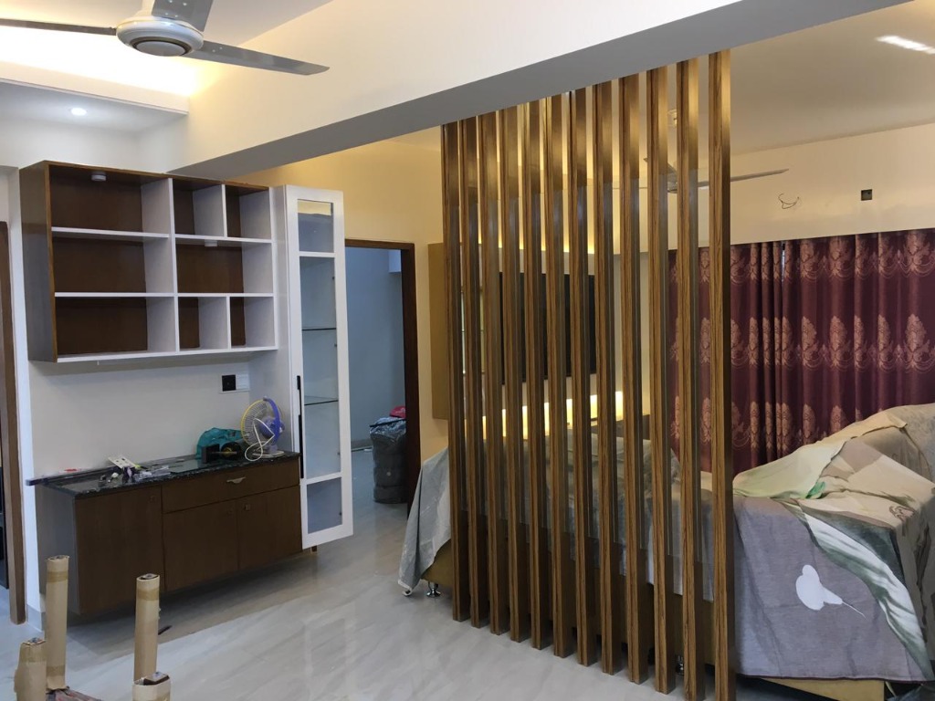 Custom fluted wood room divider with wall shelving unit